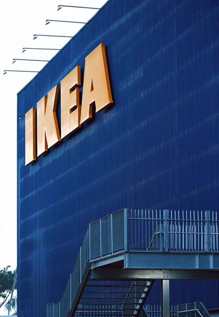 Perspective view of a blue IKEA building with logo